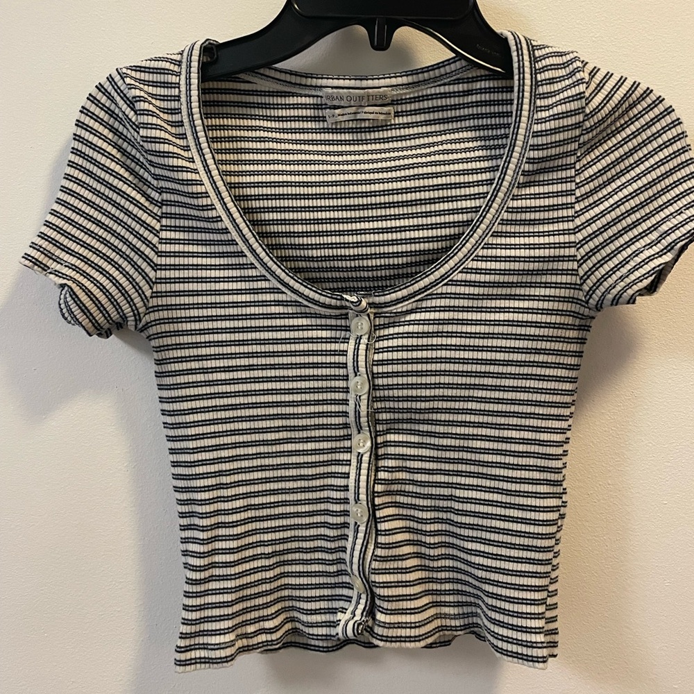 Short sleeve slightly cropped shirt.